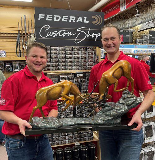 reeds family outdoor outfitters holding president's award